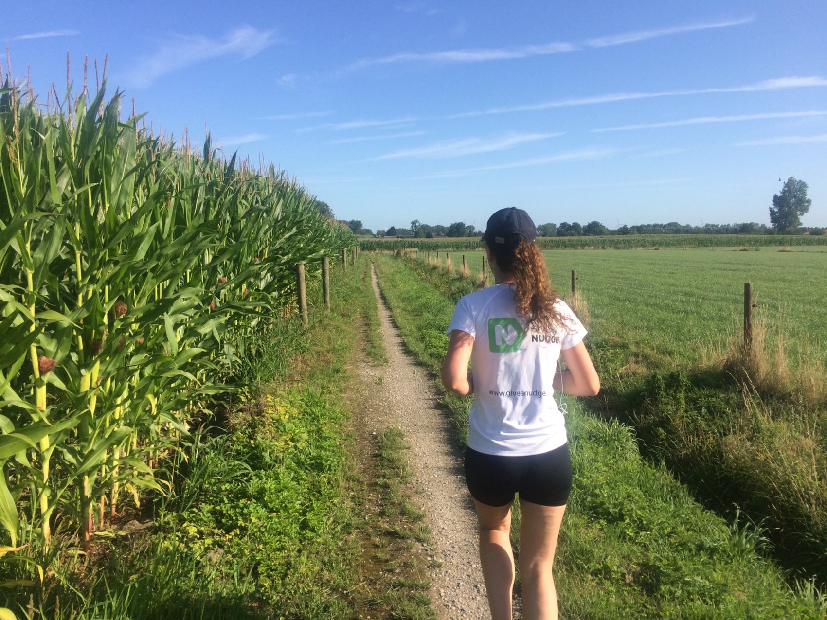 Running in a Give a Nudge shirt